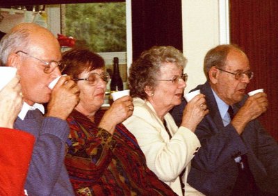 Members celebrate with a champagne toast
